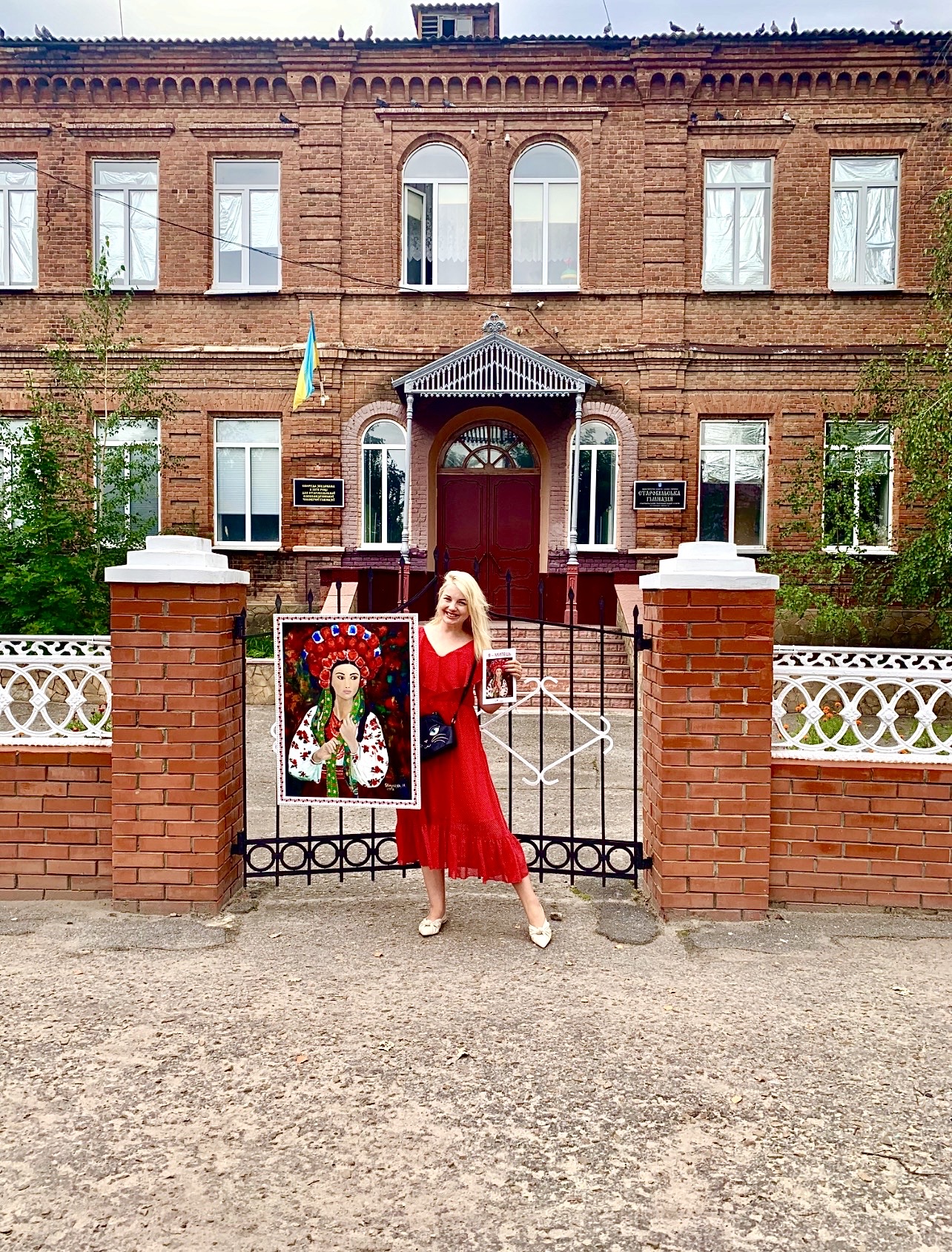 Ukrainian artist Marina Stognieva outside her former school in Starobilsk in 2019